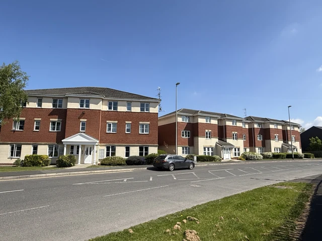 Group of residential apartment buildings with landscaped common grounds
